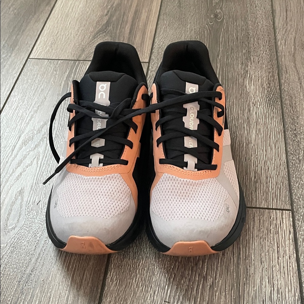 On Running Black and Peach Athletic Shoes